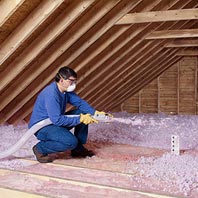 Attic insulation enhancing home air conditioning by reducing heat transfer and air flow.