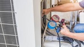 Skilled HVAC Technician Repairing an AC System